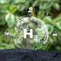 Graphic of the earth with the periodic hydrogen symbol on it, growing out of soil and surrounded by icons of energy generators and users