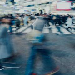 time lapse photo of pedestrians on city street