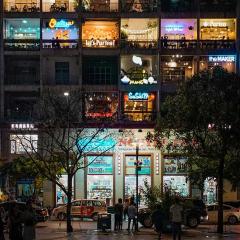 Building in Ho Chi Minh with businesses in each window